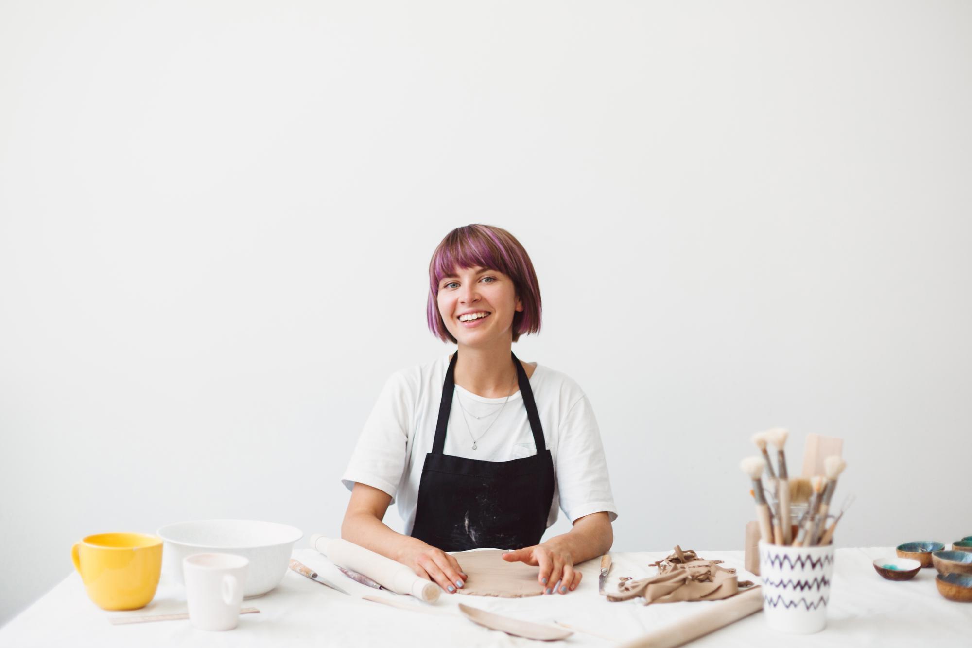 Instructor smiling in a bright kitchen studio